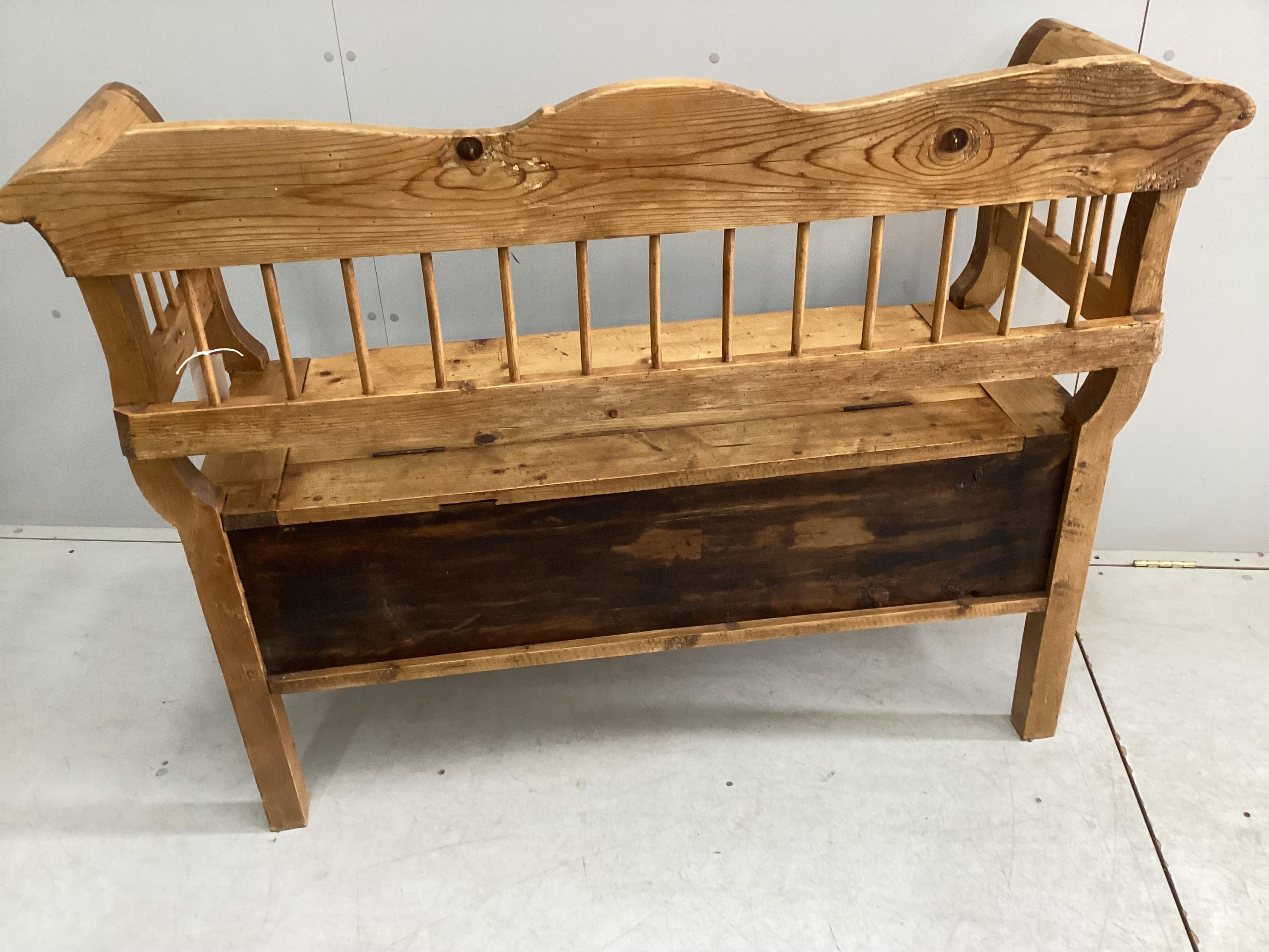 A 19th century Continental pine box seat settle, width 132cm, depth 47cm, height 100cm. Condition - fair to good
